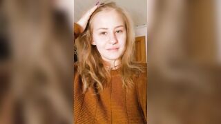 A simple modest girl, a simple modest sweater... and underneath it?